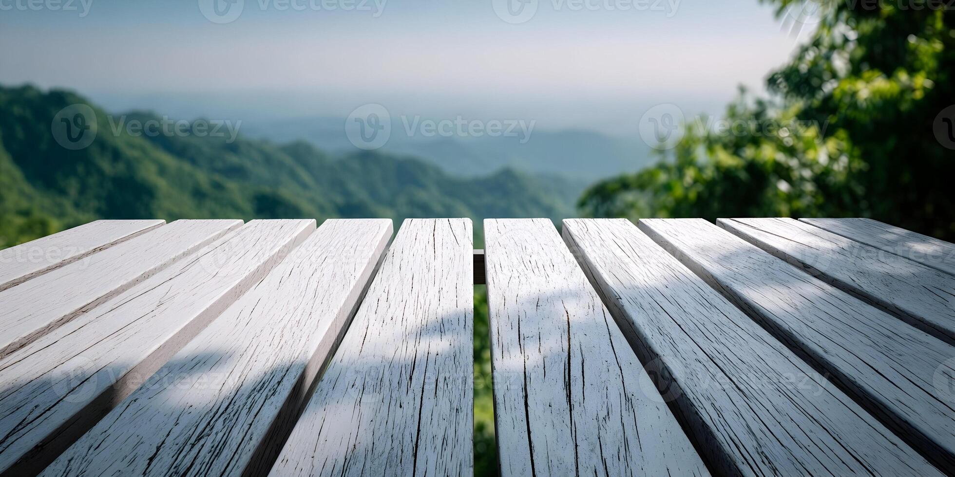 White Wooden Tabletop Overlooking Lush Green Mountains Scenic View photo
