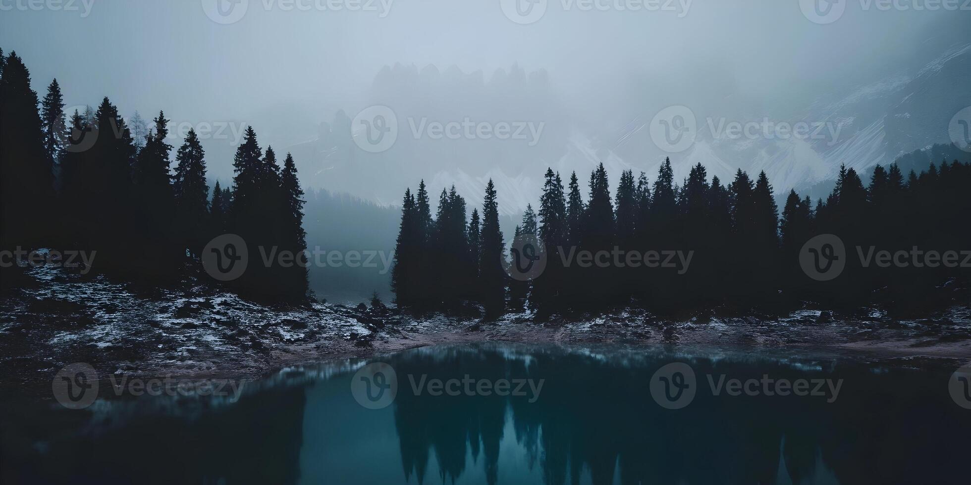 Misty Mountain Lake with Dark Coniferous Forest Reflection photo