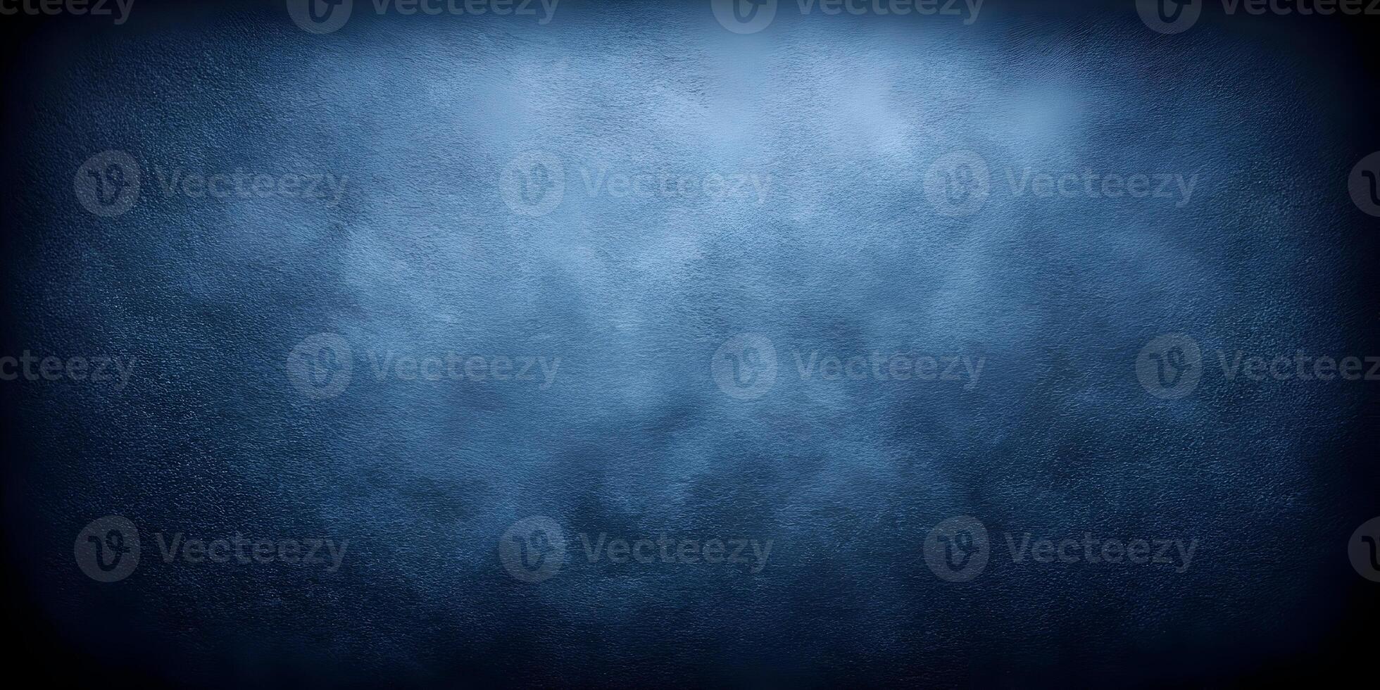 a dark blue background with a light in the center photo