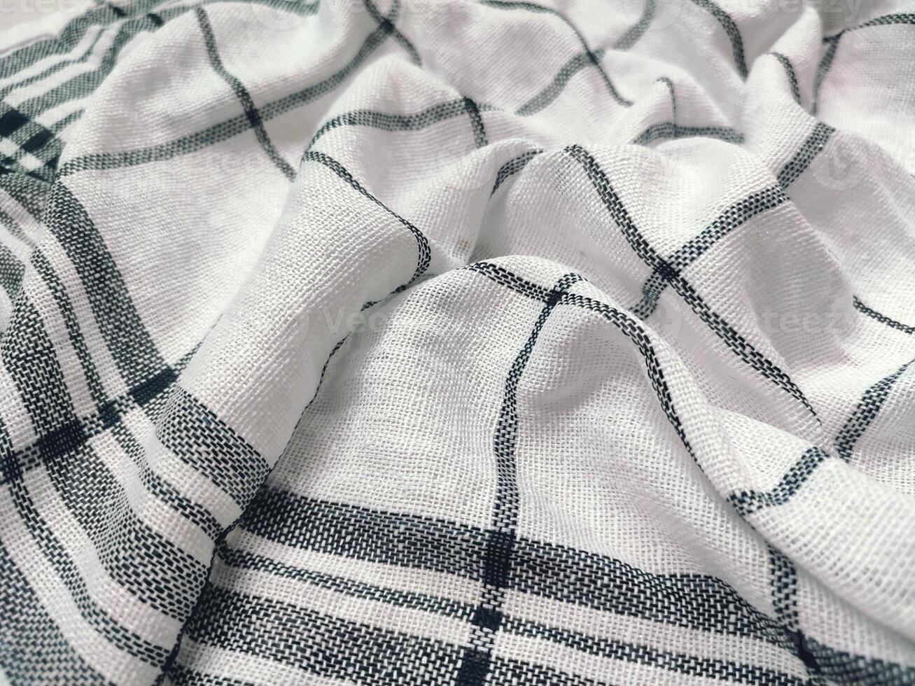 black striped white napkin that is tattered photo