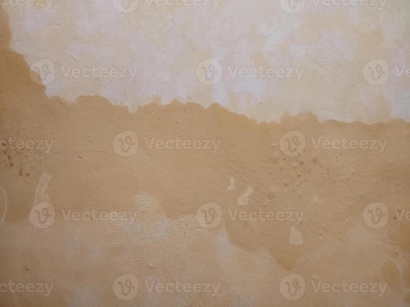 a wall with a brown stain on it photo