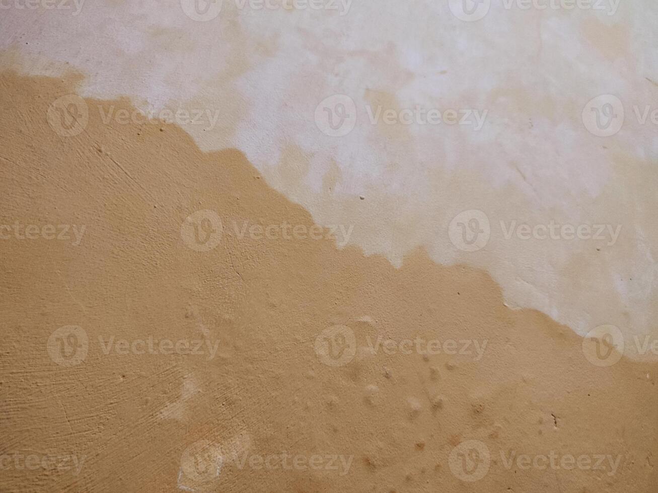 texture rough and uneven yellow wall background, creating a lively and abstract background. photo