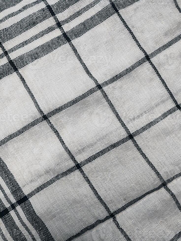 a close up of a black and white checkered fabric photo