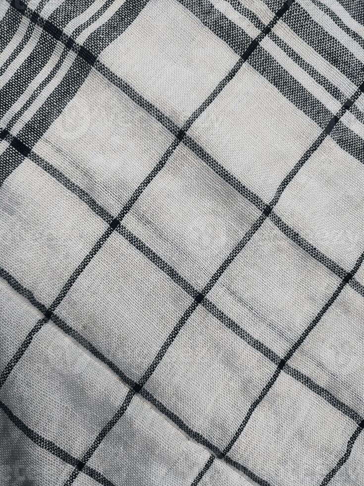 a close up of a black and white checkered blanket photo