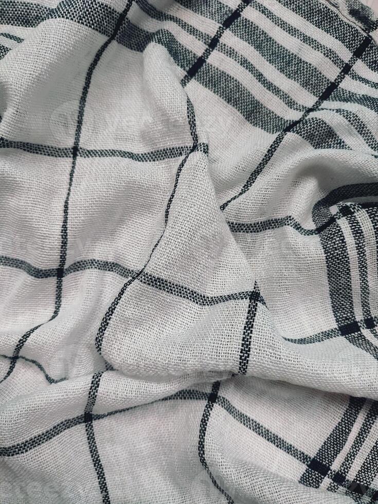 a white and black checkered fabric with a black and white check pattern photo