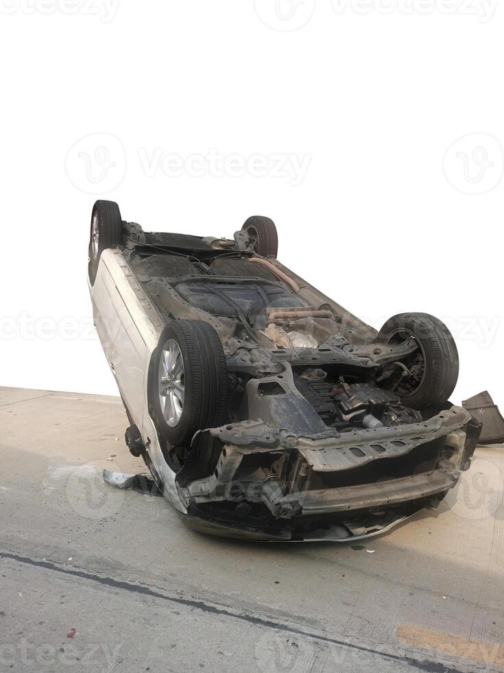 Cars damaged after crashing and overturning on the road during daytime. Car accident. photo