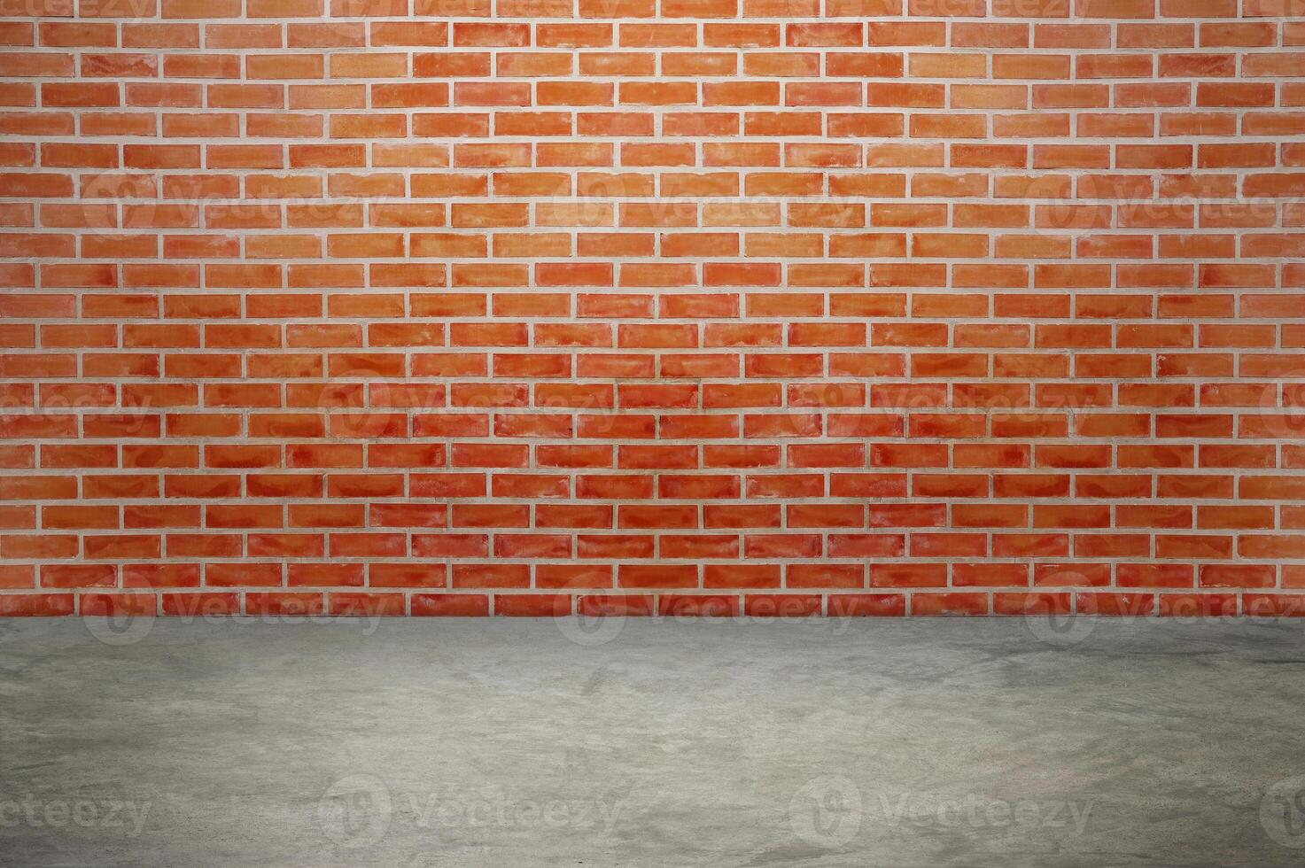 An empty room with red brick walls. The red brick walls create a warm atmosphere. photo