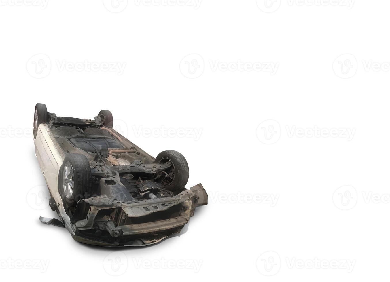 Car damaged after overturned, isolated on white background. Car accident. photo