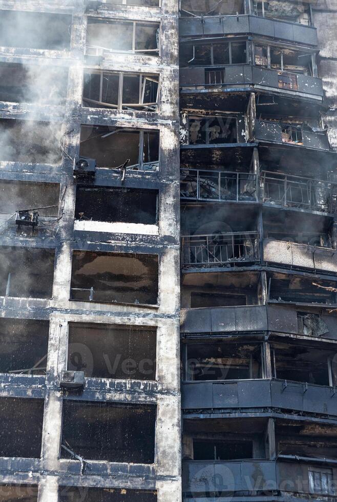 Burnt structures of a multi-storey building after shelling by the Russian army photo