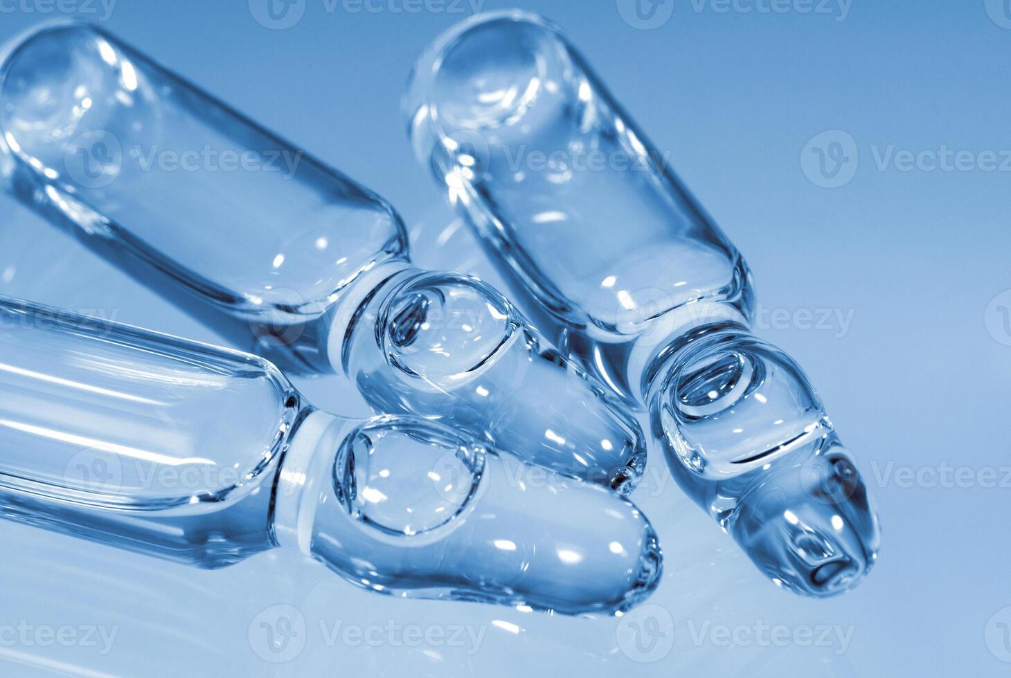 Medical glass ampoules for injections closeup photo
