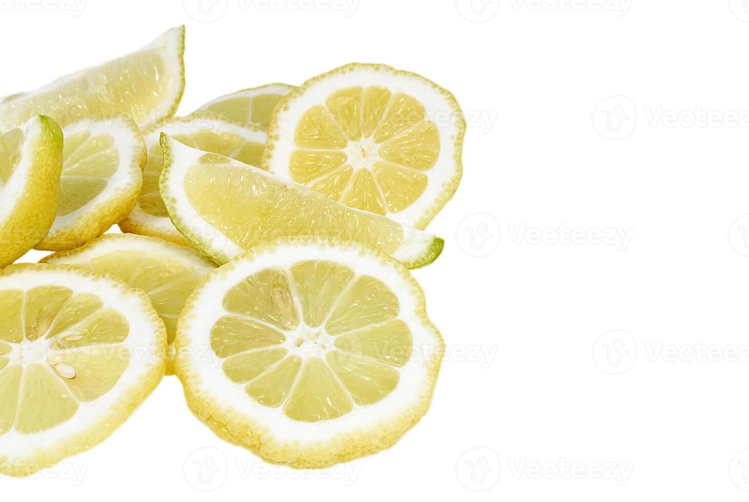 Heap of fresh lemon slices on white background photo