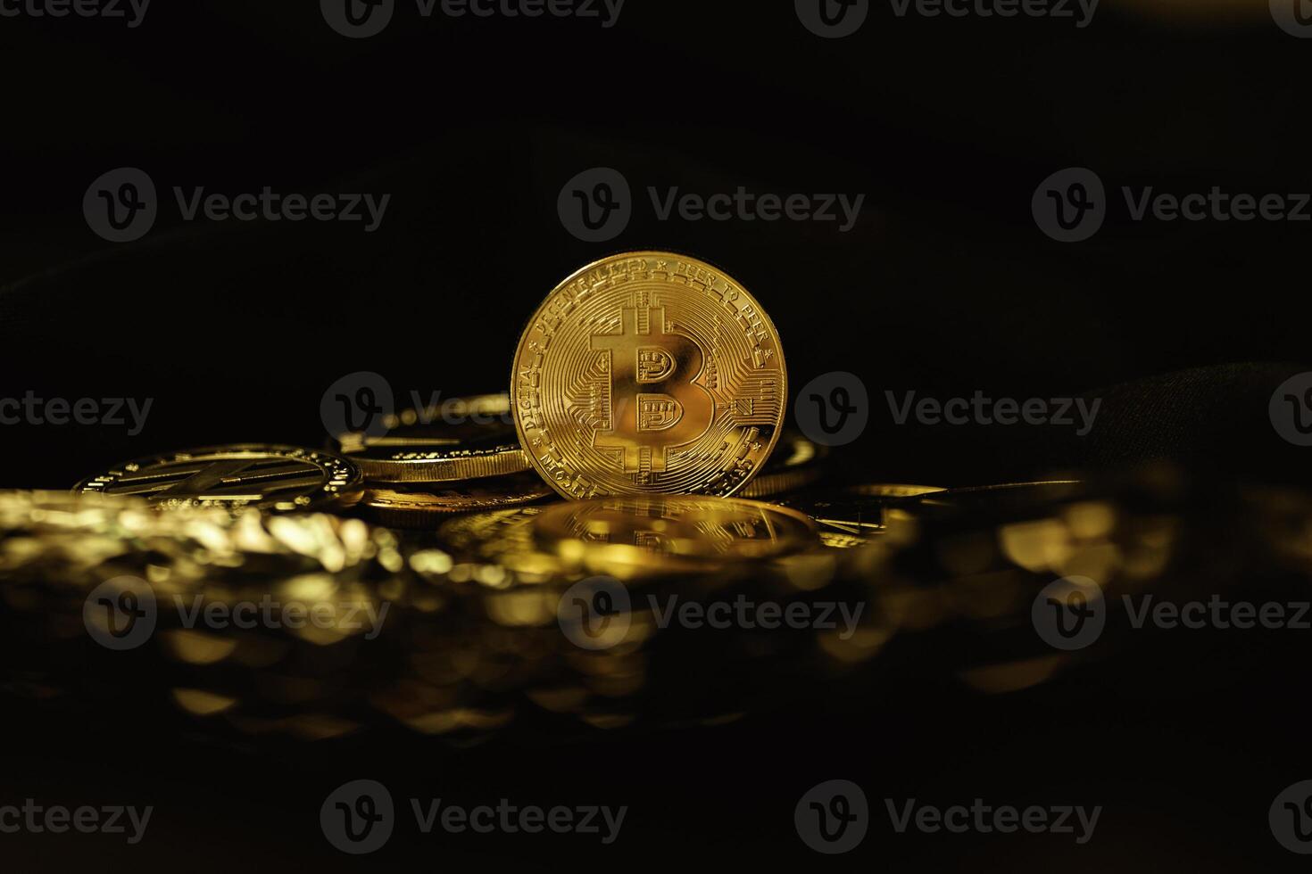 Bitcoin coins on a black background. Currency of the future. The world crisis photo