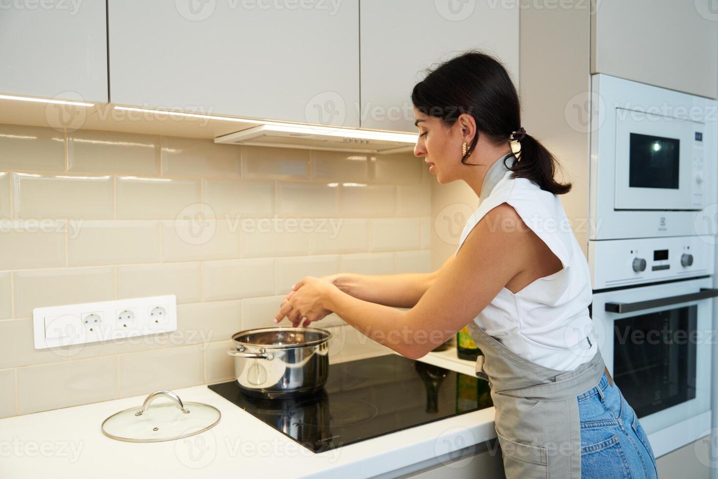 Cooking a healthy meal in a modern kitchen during the afternoon photo
