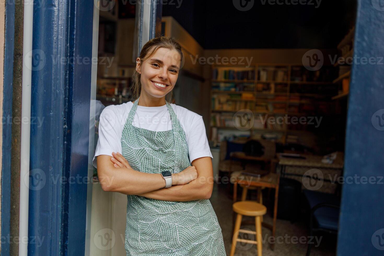 In a cozy cafe, a cheerful barista prepares drinks, creating a vibrant and warm atmosphere photo