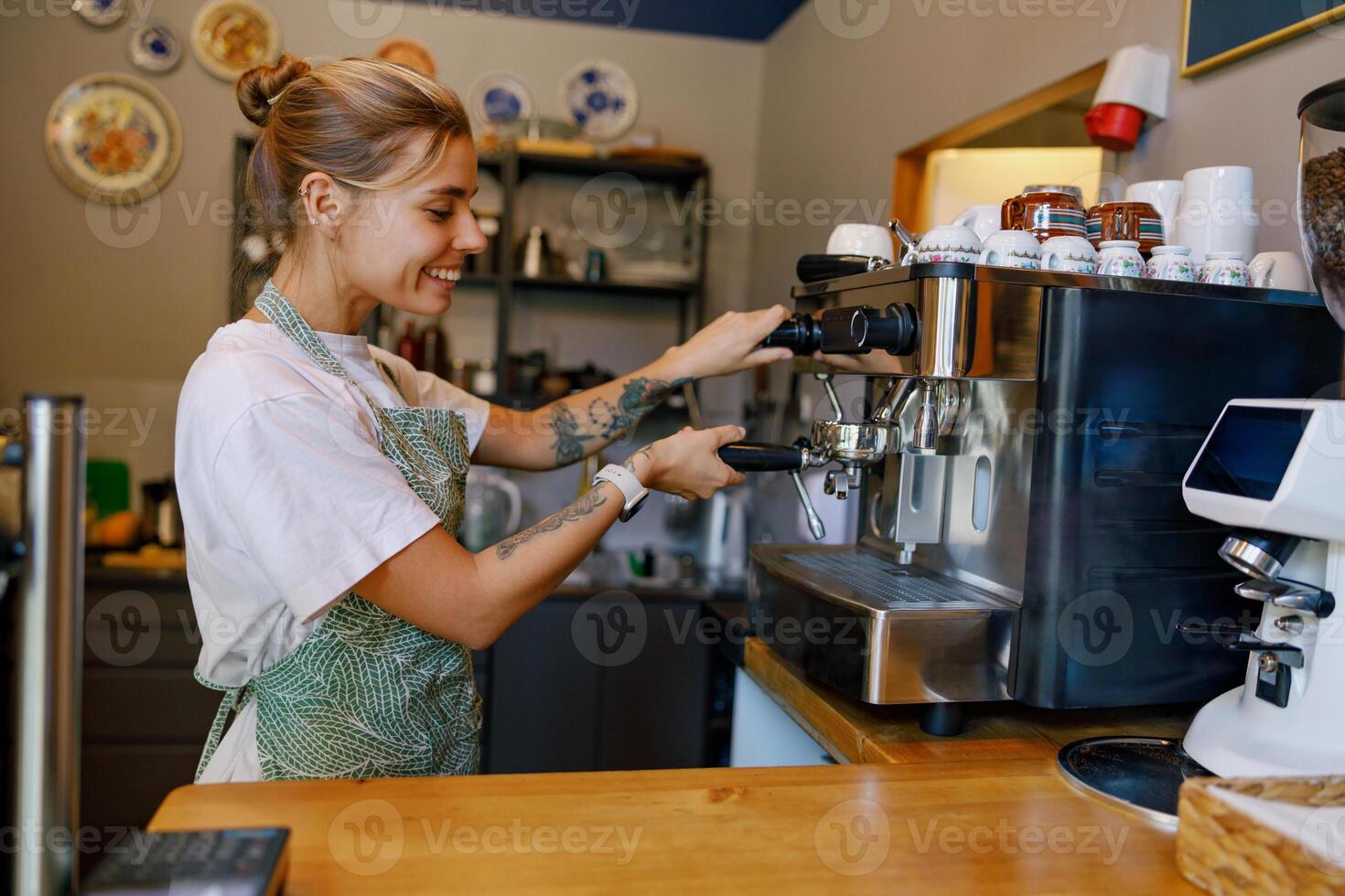 Barista at Work Skillfully Crafting the Perfect Coffee Experience in a Warm, Cozy Cafe photo