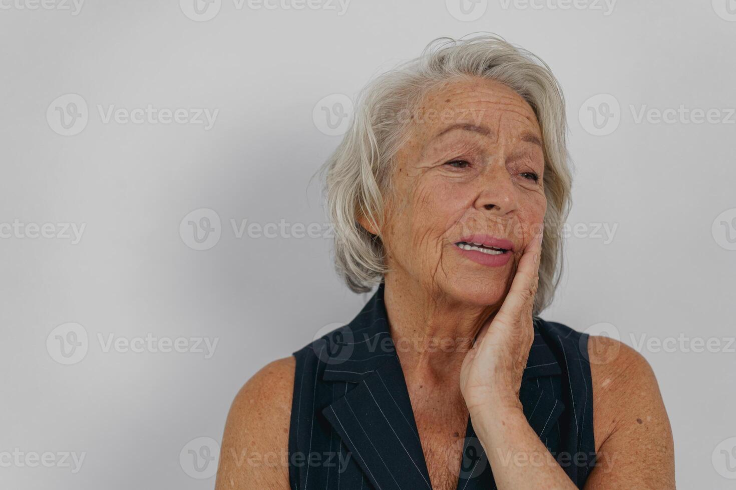 A Thoughtful Senior Woman is Reflecting with Grace and Poise on Lifes Many Aspects photo