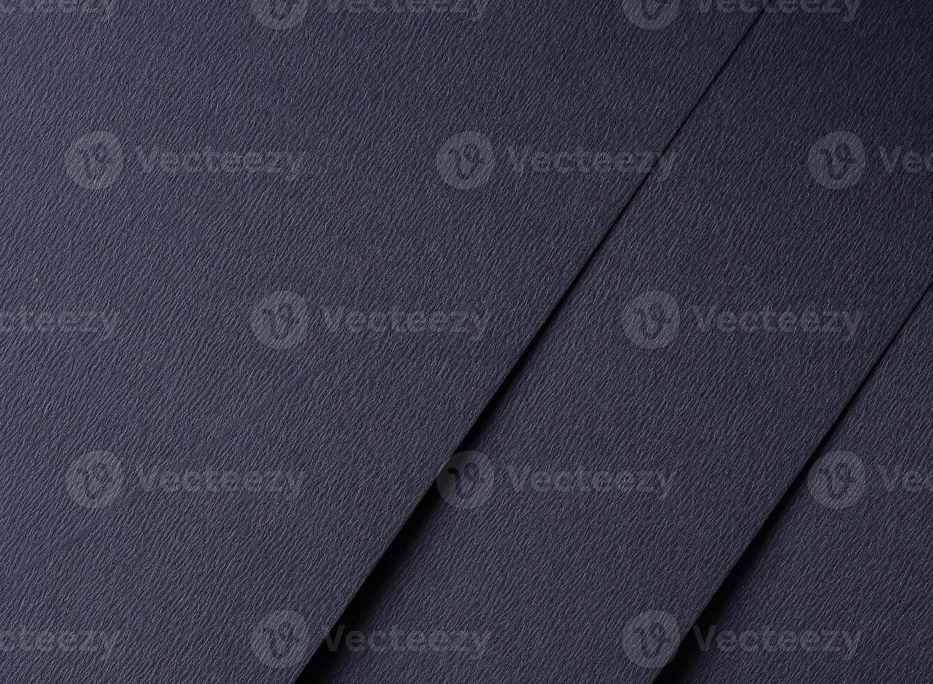 Dark blue matte paper texture with an elegant, premium finish, featuring simple geometric lines and photo