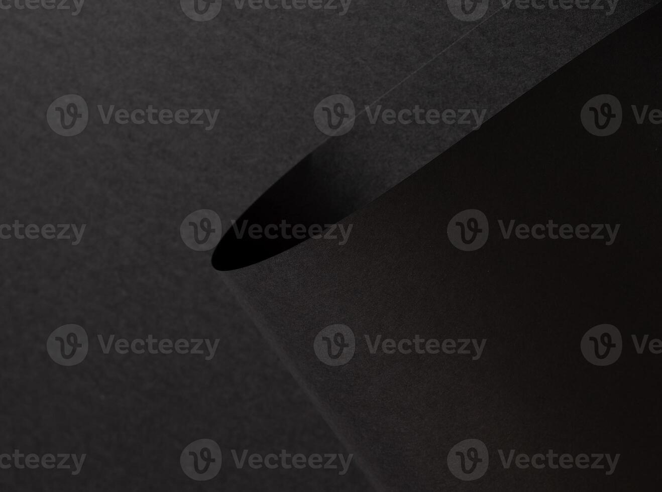 Black matte paper texture with a rich, premium finish, featuring wavy folds and edges. Elegant, photo