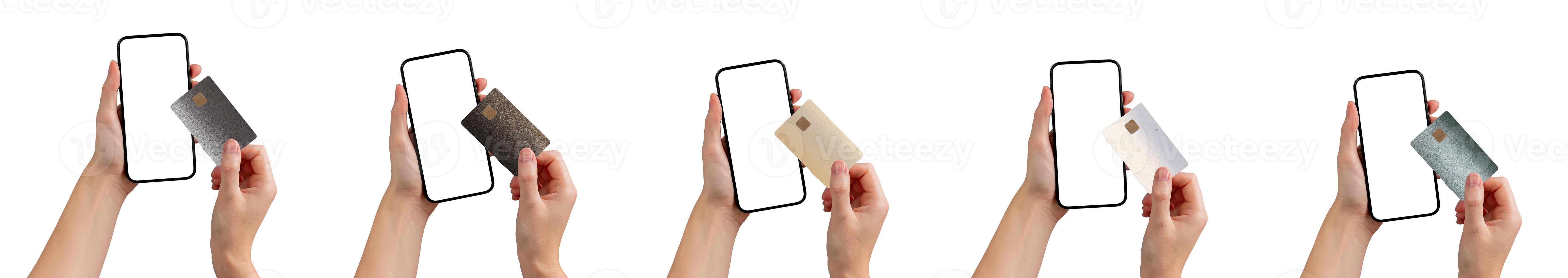 Hand holding a mobile phone displaying a bank app for cashless payment. Credit and debit options for photo