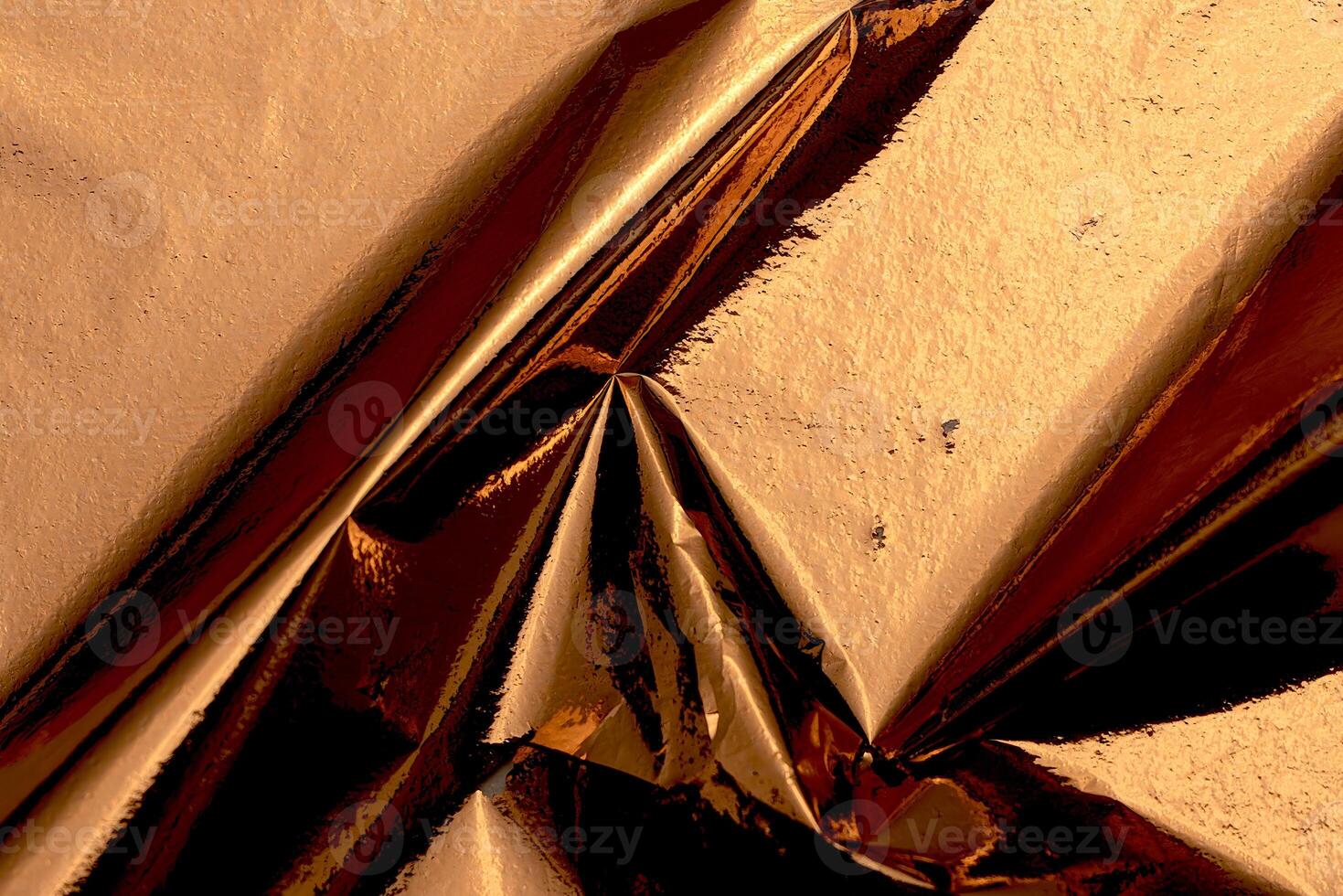 Golden and copper foil texture with a glossy, metallic finish, creating a sleek, modern backdrop. photo