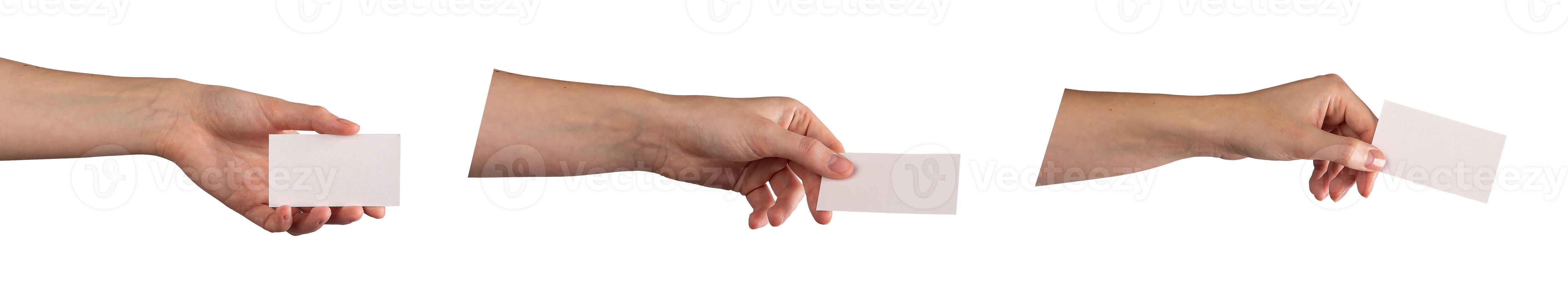 Hand holding a blank business card, offering it with fingers outstretched, ready to give or receive. photo