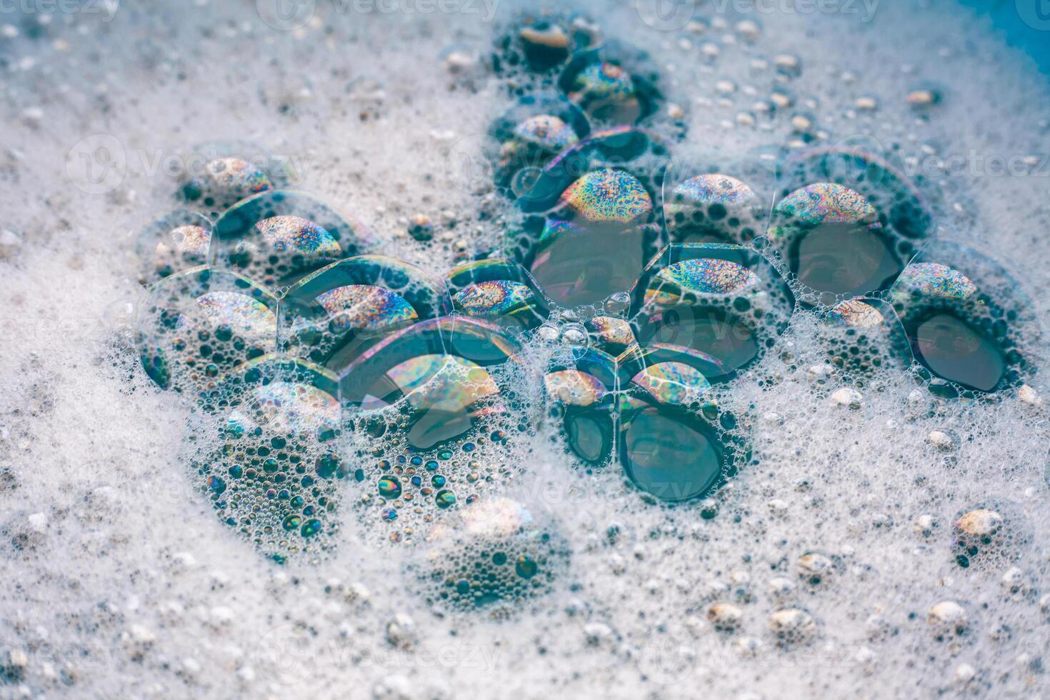 White soap foam. The texture of soap bubbles in close-up. Bubble bath. Laundry gel. Soap for washing photo