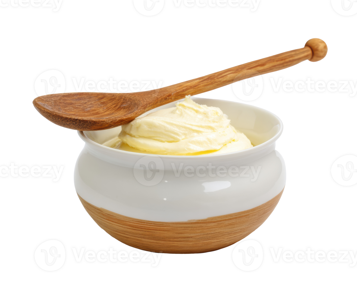 Creamy butter in a bowl with a wooden spoon for cooking needs png