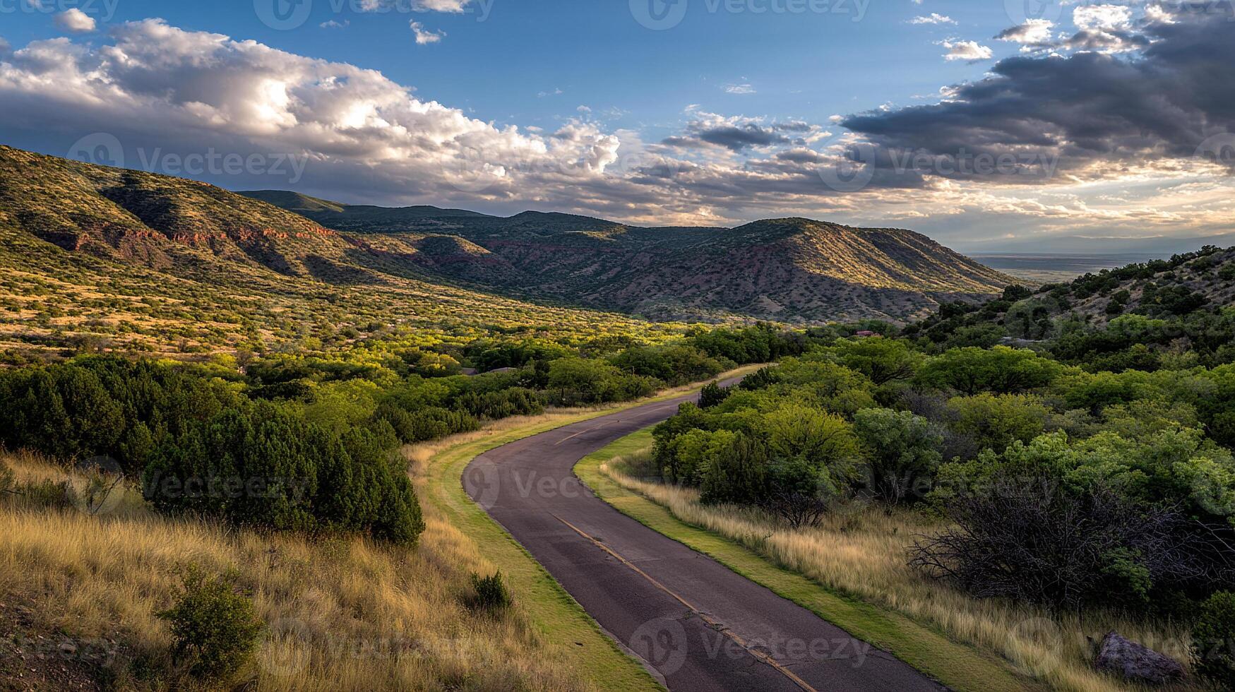 Road through colorful countryside on sunny day photo
