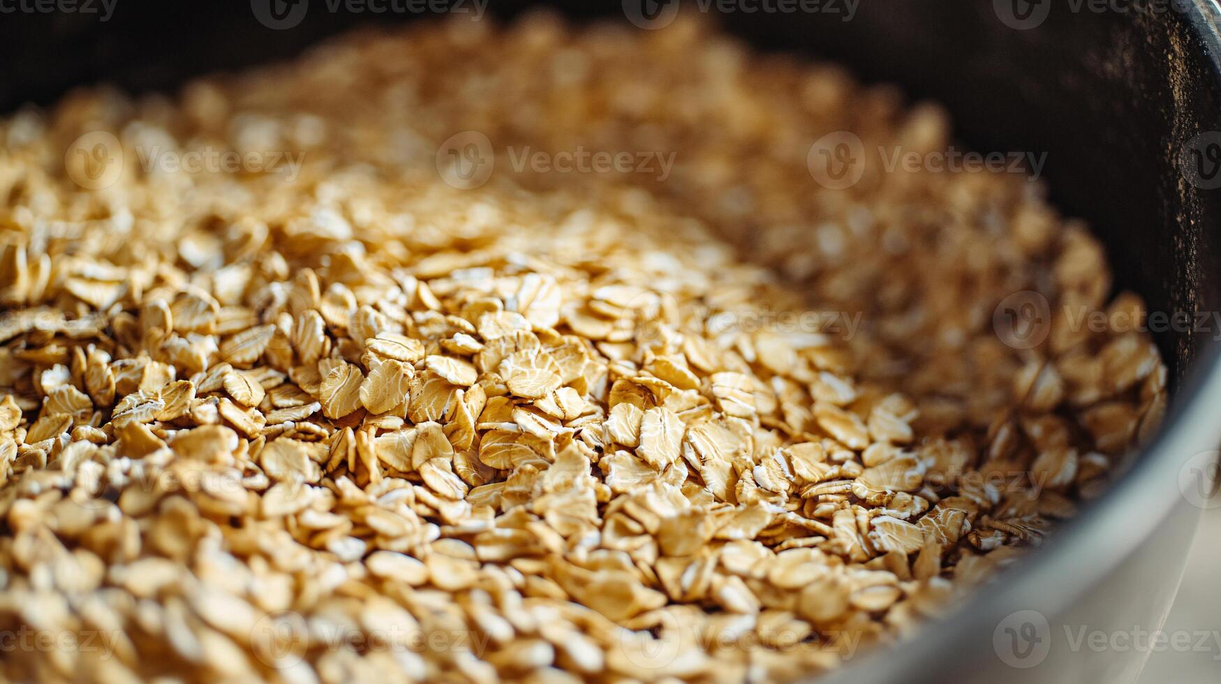 Preparing a Wholesome Porridge from Freshly Rolled Oats for Breakfast photo