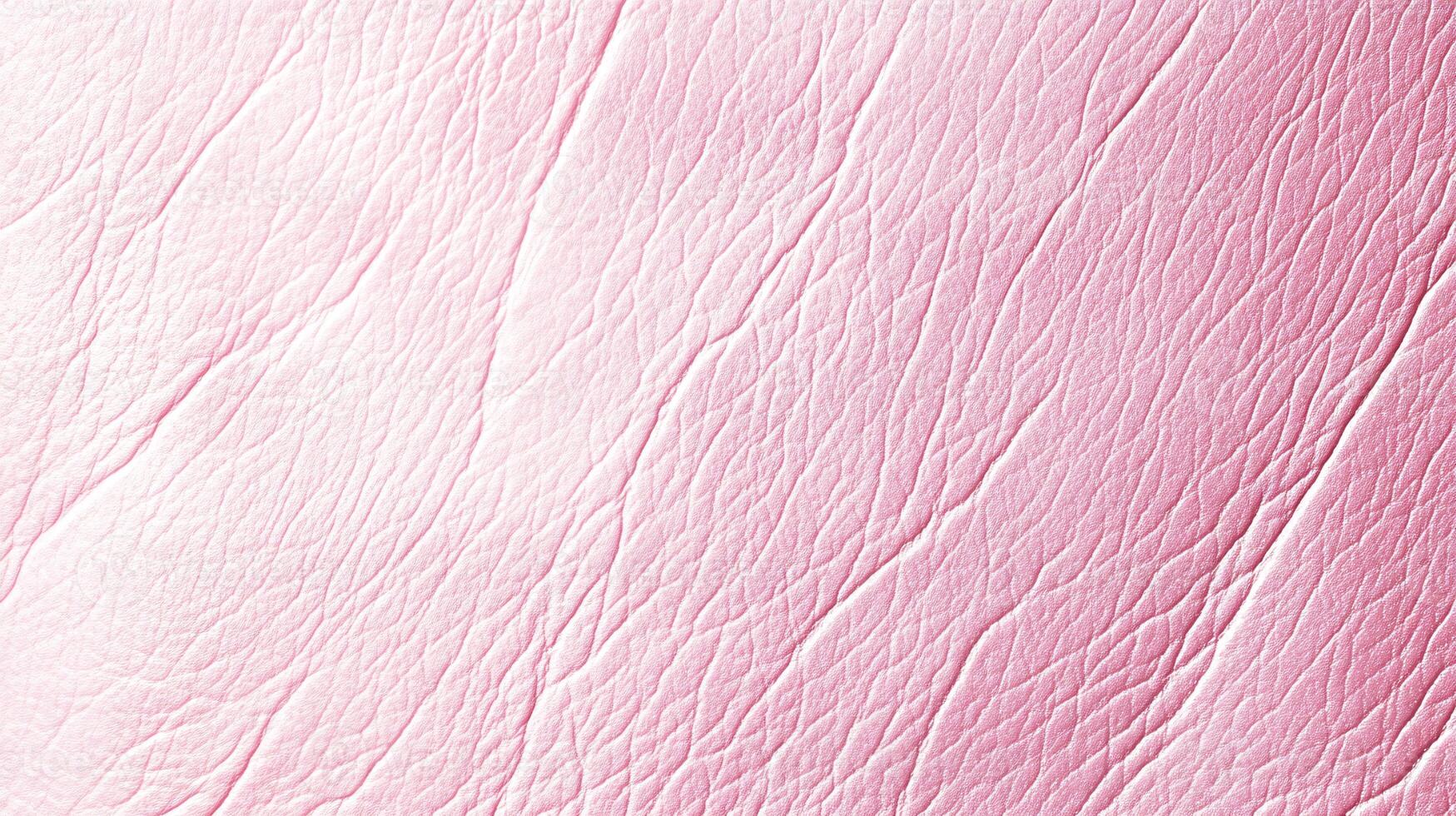 Light Pink Grainy Leather Texture with Subtle Highlights and Shadows photo