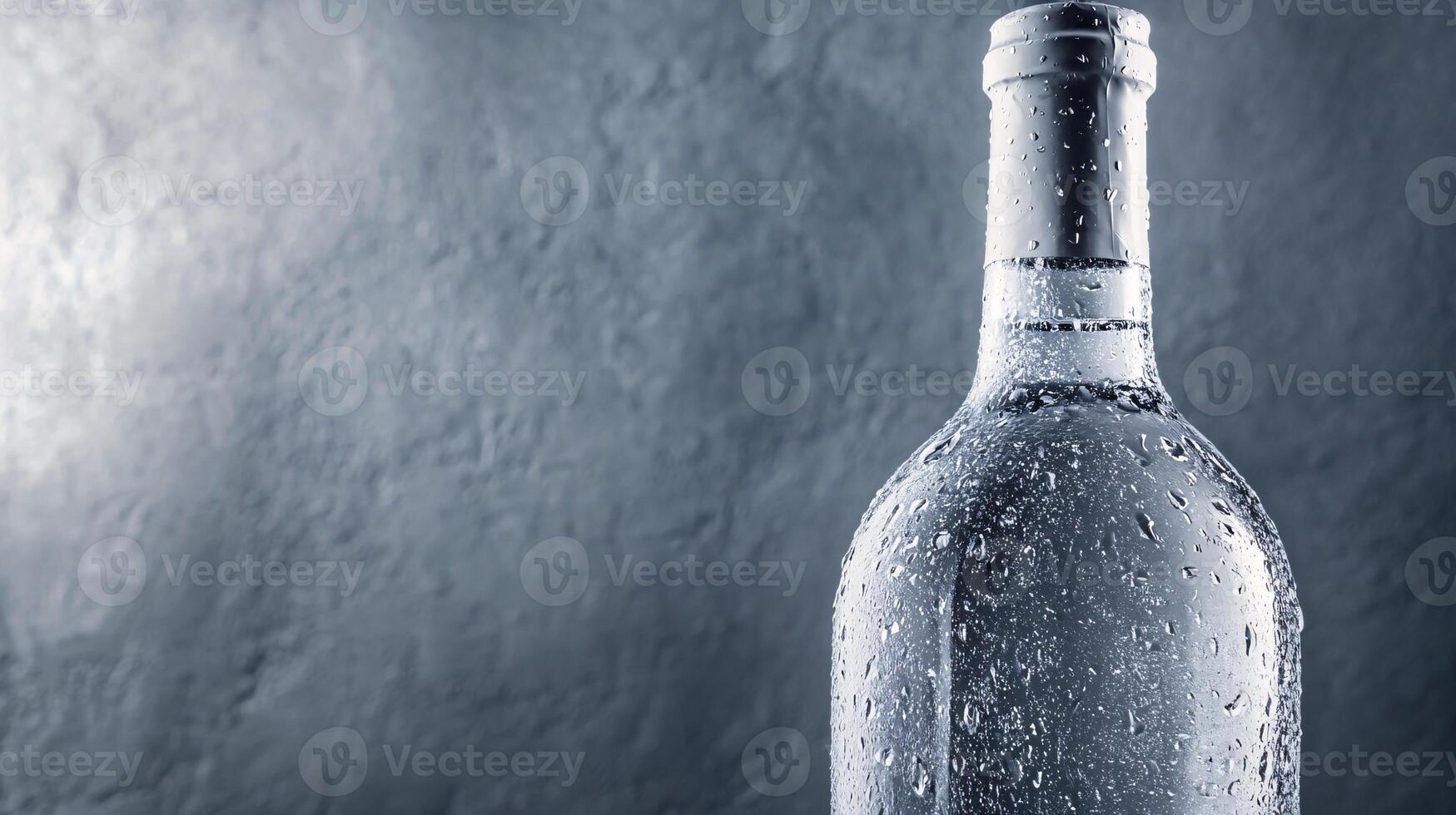 Elegant ice wine display with condensation highlighting sleek glass photo