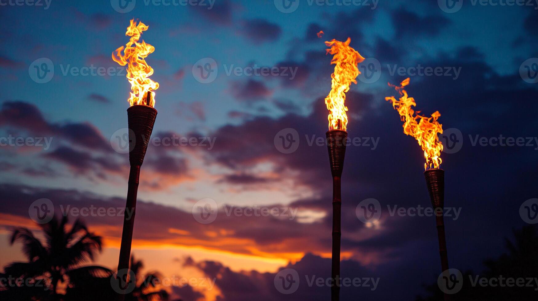 Beautiful Sunset at Hawaii Luau with Open Flames and Tropical Decorations photo