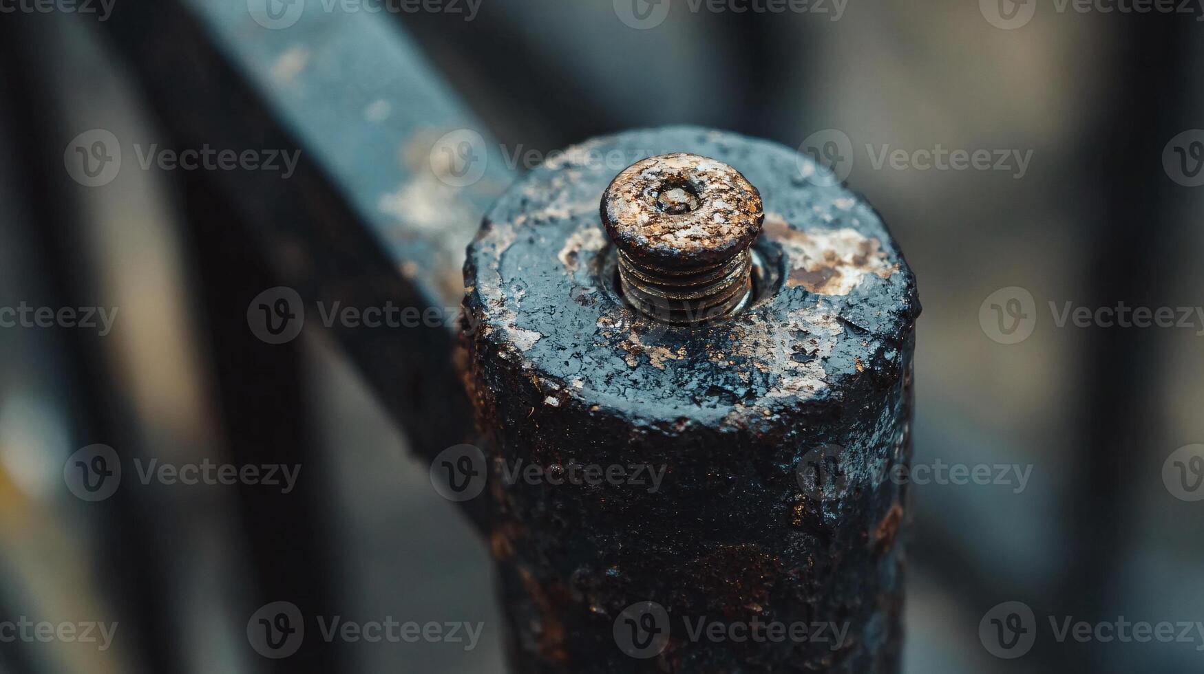 Detailed View of a Corroded Screw Resting on an Old Railing photo