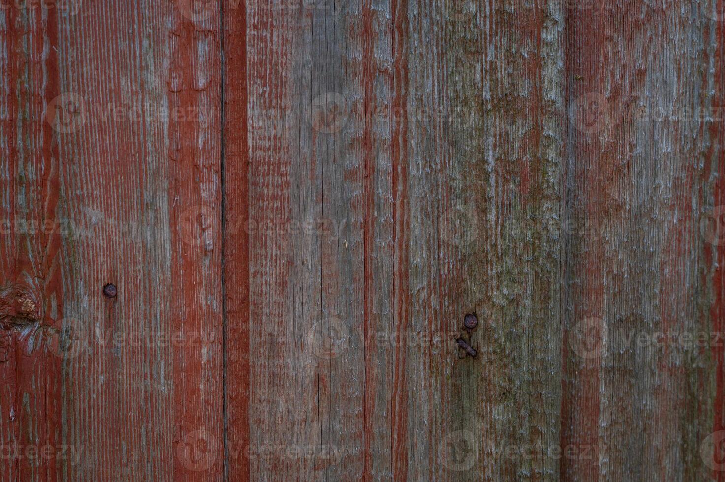 Close-up of old wooden surface with peeling brown paint, rustic weathered texture with vintage and natural details photo