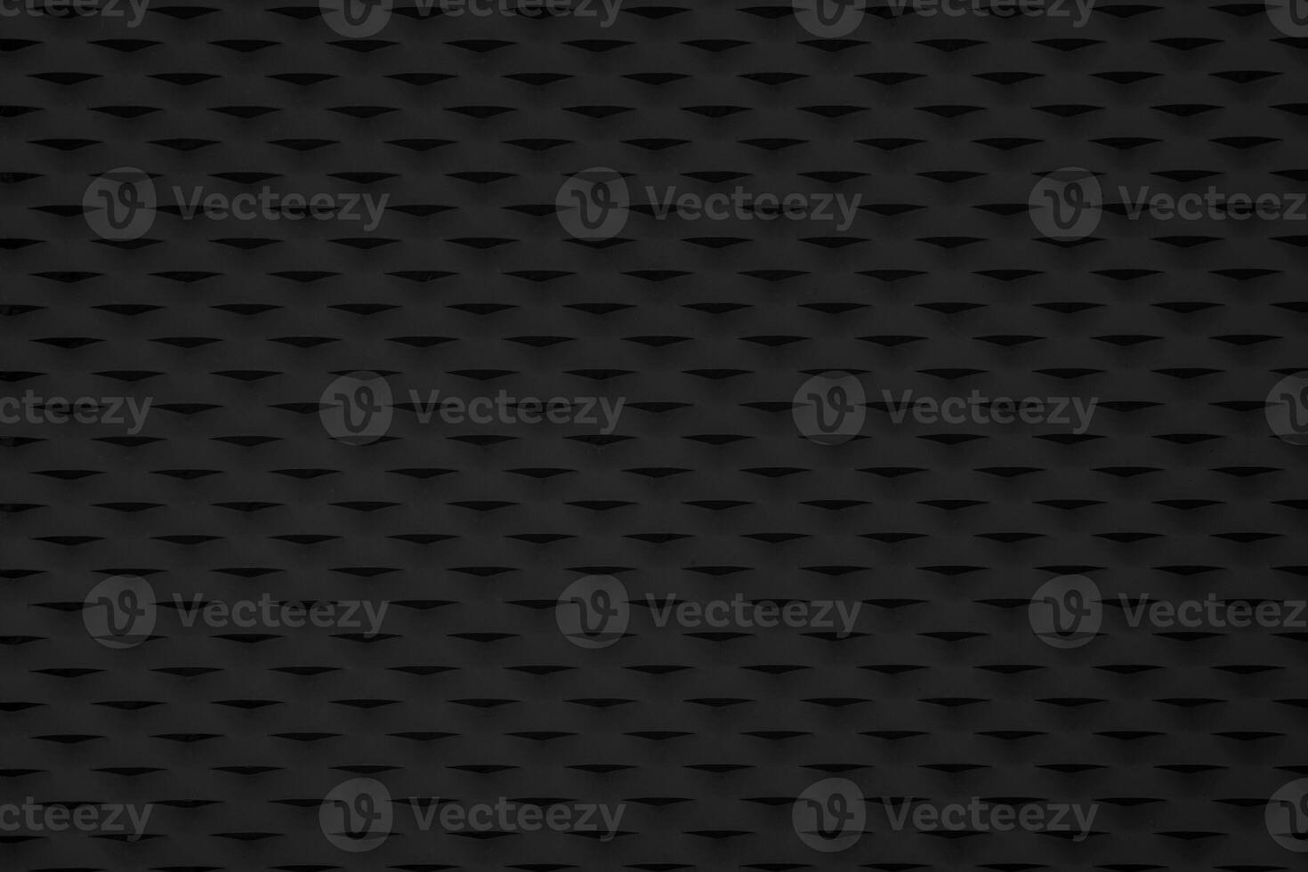 A black background with a pattern of squares. The squares are arranged in a grid. photo