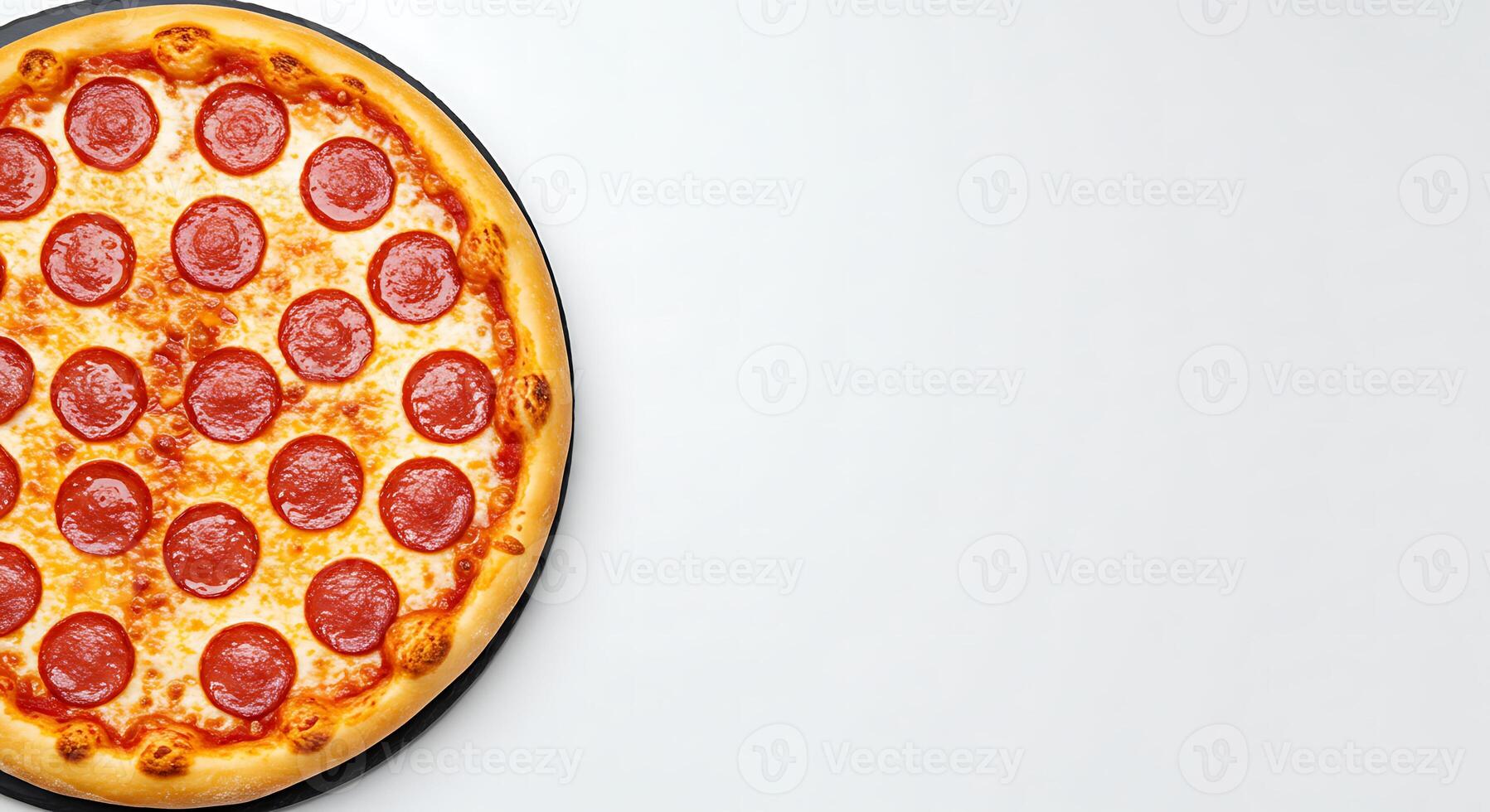 A pepperoni pizza on a white surface photo