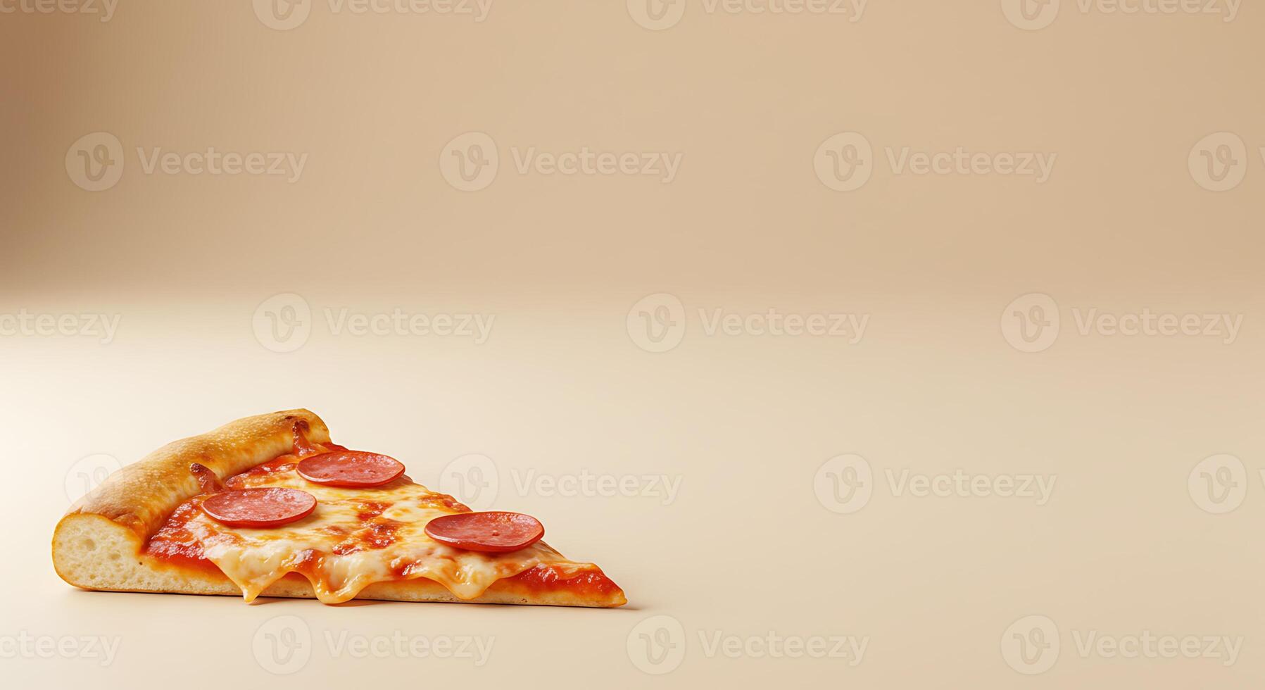 A slice of pizza on a beige surface photo