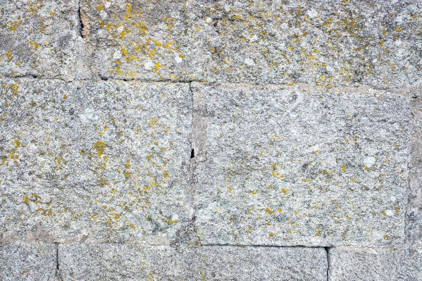 construction material textured granite blocks forming a robust and durable wall photo