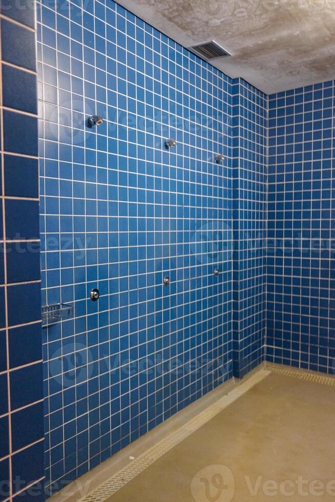 Empty and Clean Locker Room Showers at a Gym or Swimming Pool. photo