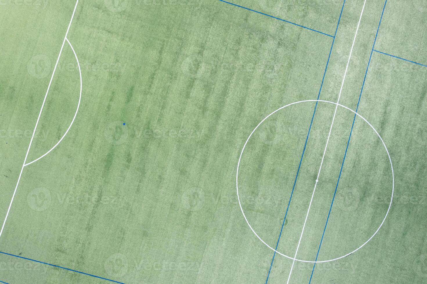 geometric patterns center of a turf soccer field, aerial drone view photo