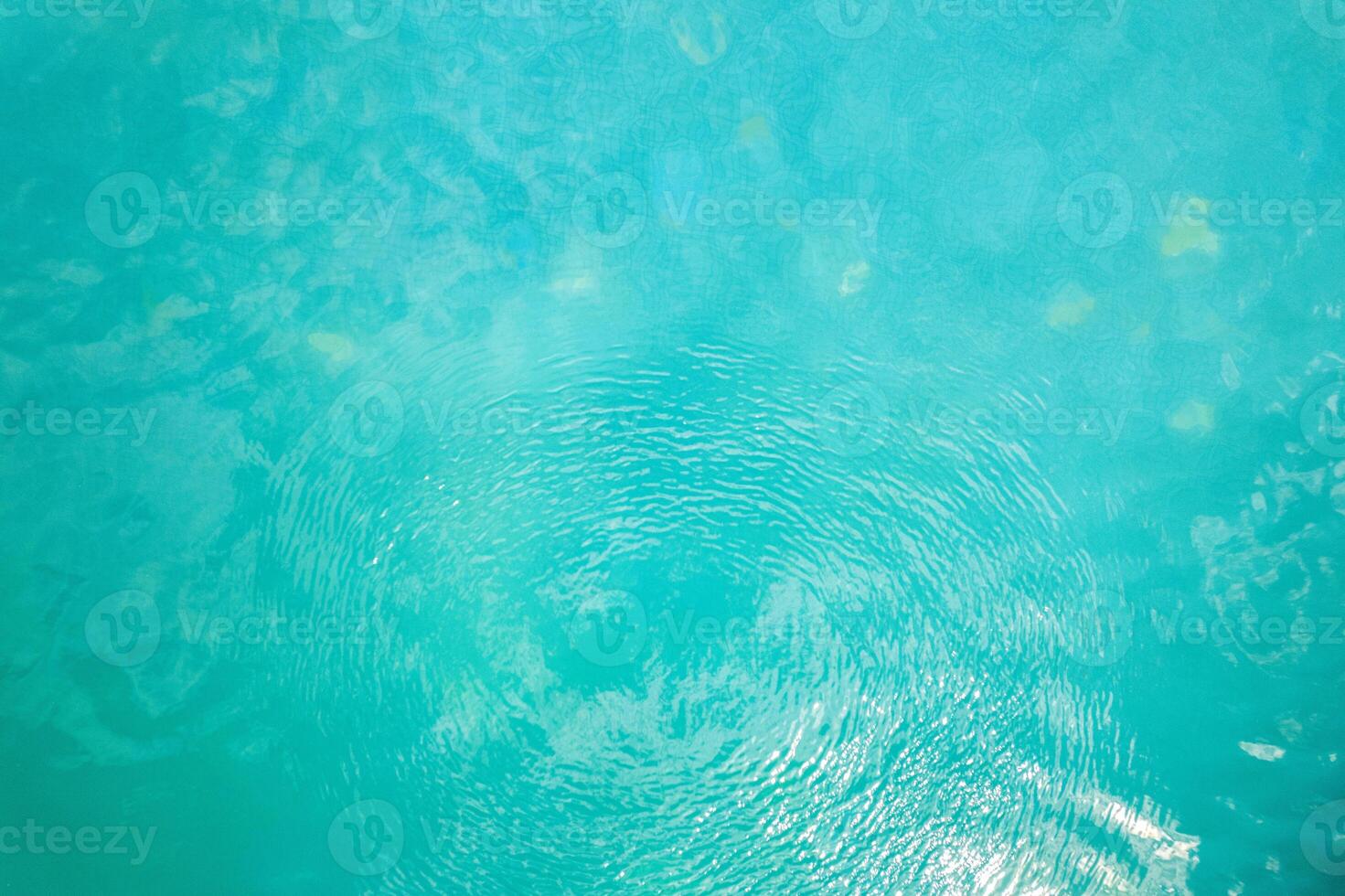 light and ripples distorting swimming pool tiles abstract pattern of turquoise water ripples photo