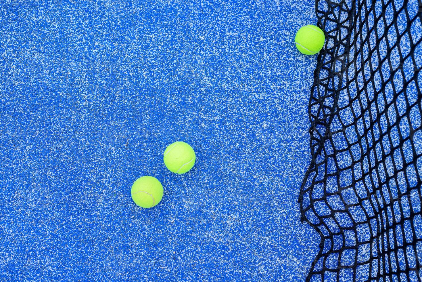 top down view of an empty paddle court showcasing lines and net photo