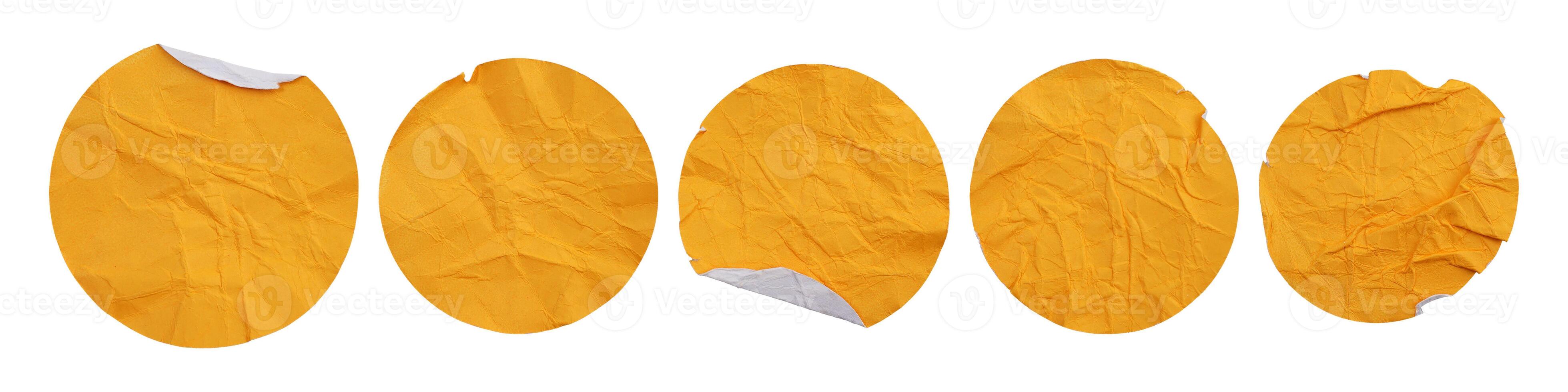 Set collection of blank crumpled yellow paper stickers in round shape isolated on white background photo