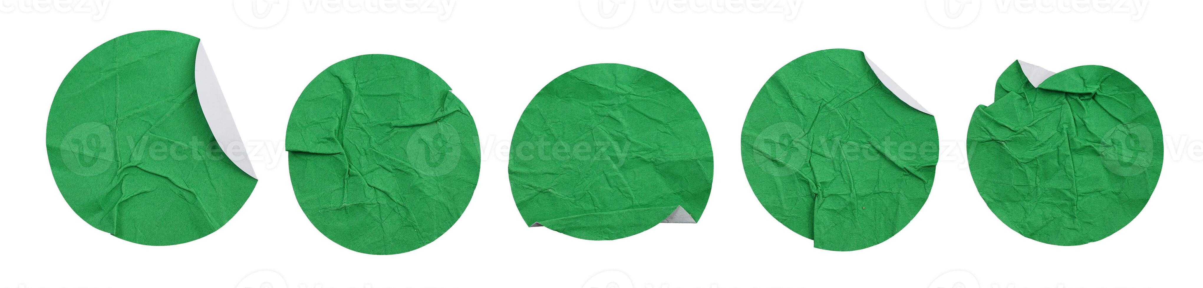 Set collection of blank crumpled green paper stickers in round shape isolated on white background photo