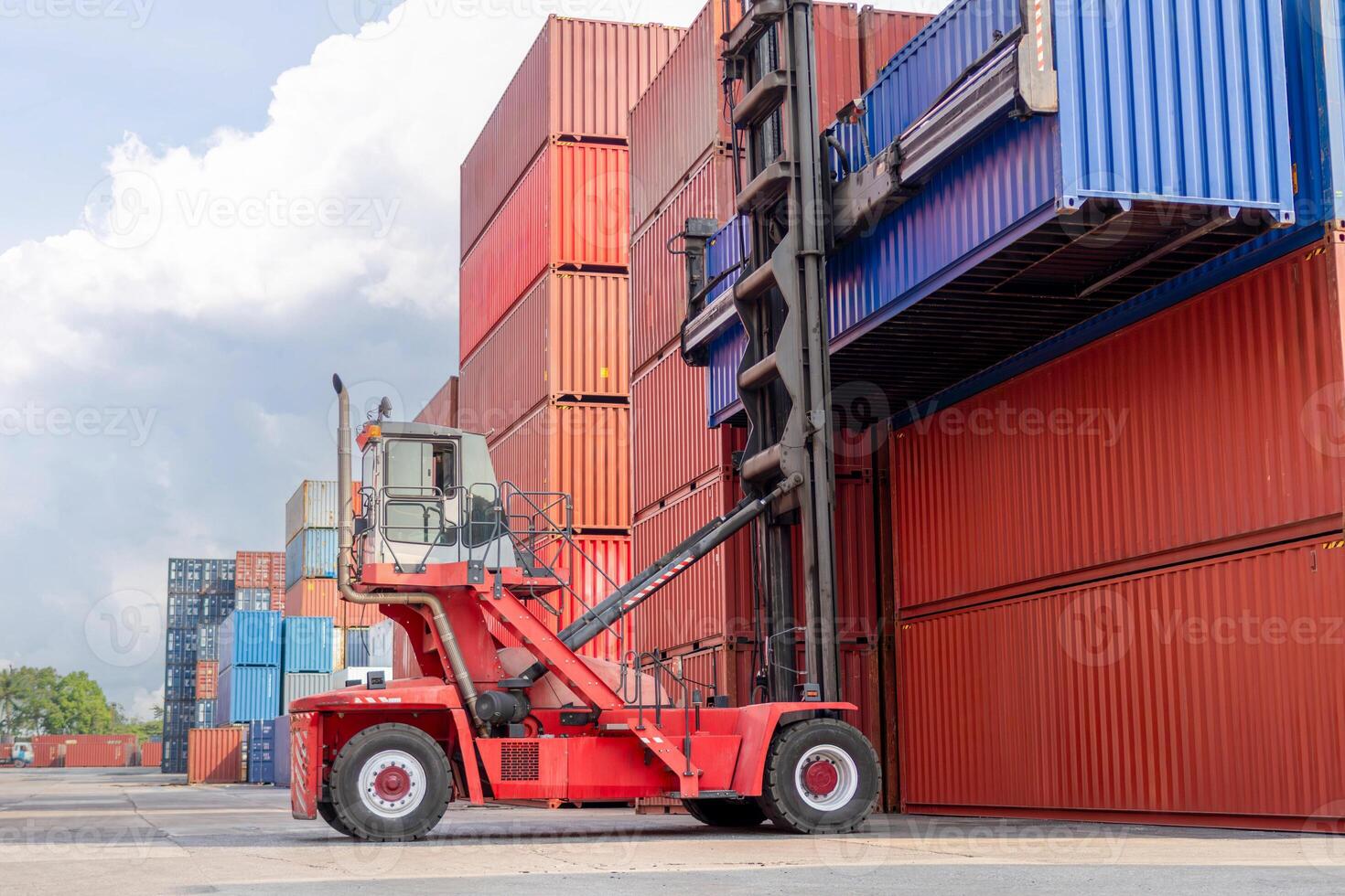 Logistics and Global Trade Container Yard Operations for Background Concept, Forklift Stacking Shipping Containers at Port Terminal photo