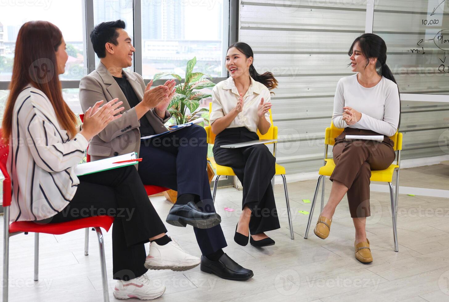 Asian Professionals Collaborating Meeting on Project, Business Team Discussion in Modern Office, Group of Colleagues Engaged in Brainstorming Session photo