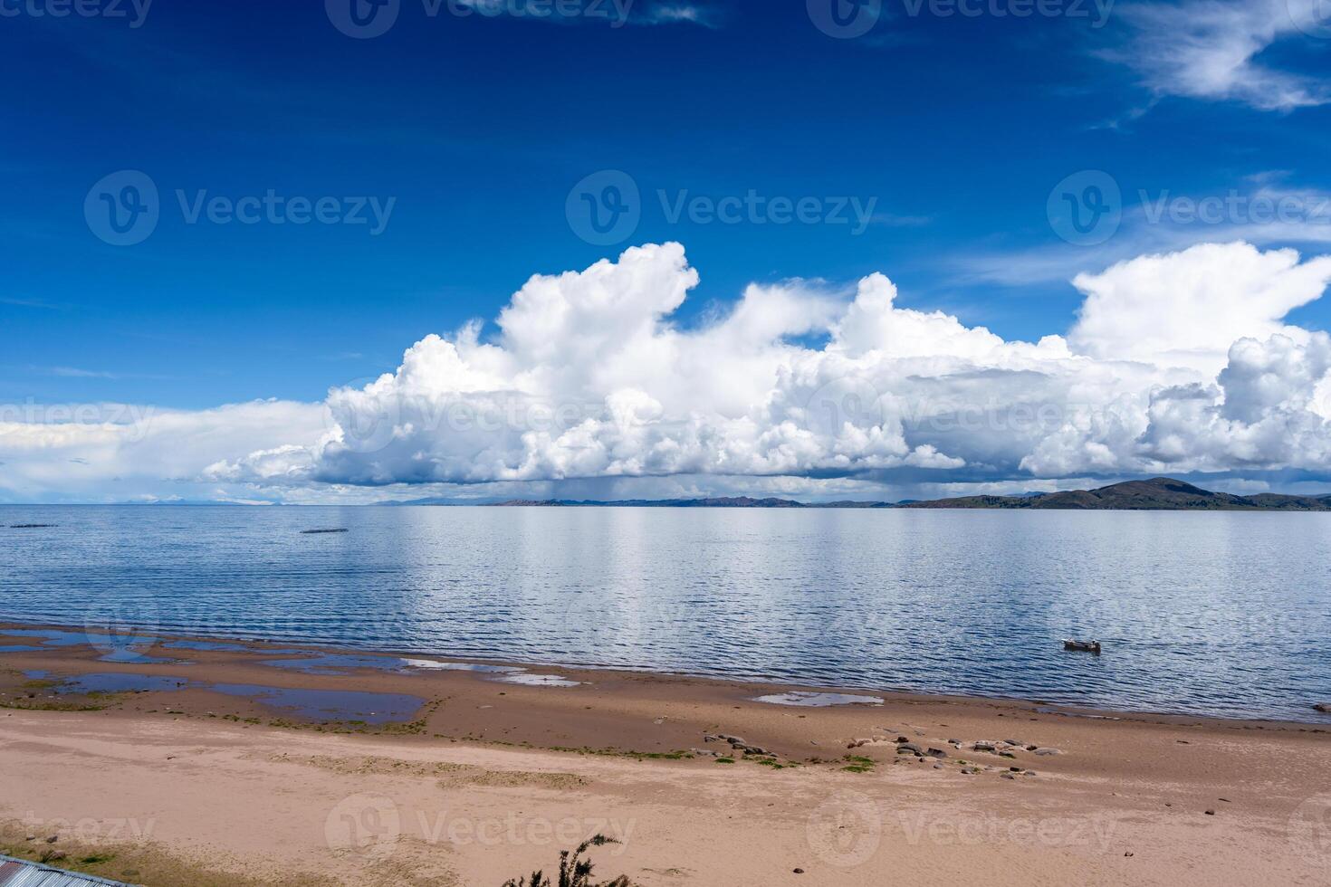 The Llachon beach with a scenic view of Lake Titicaca, Peru photo