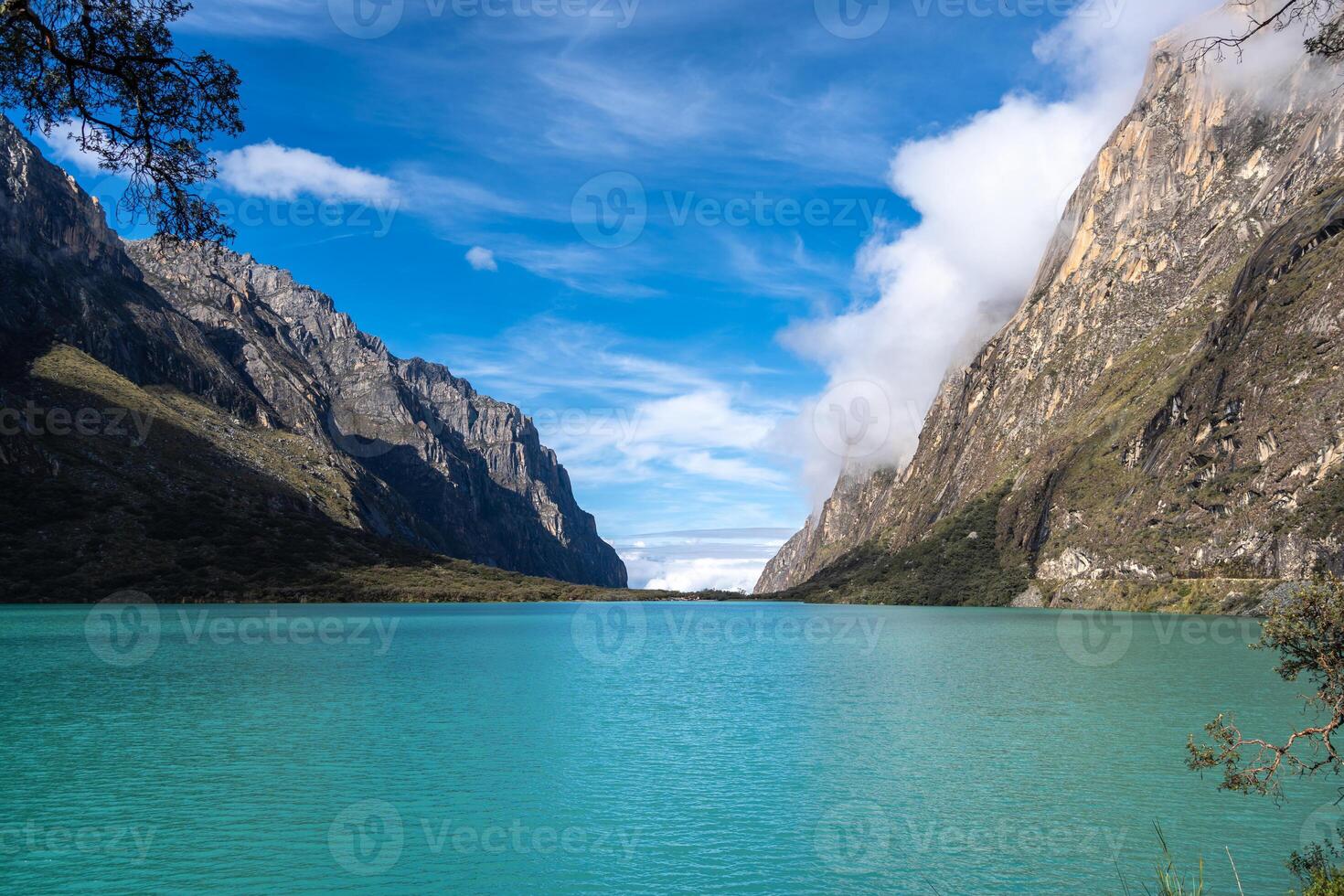 A Turquoise lake surrounded by mountains on the Laguna 69 trek, Peru photo