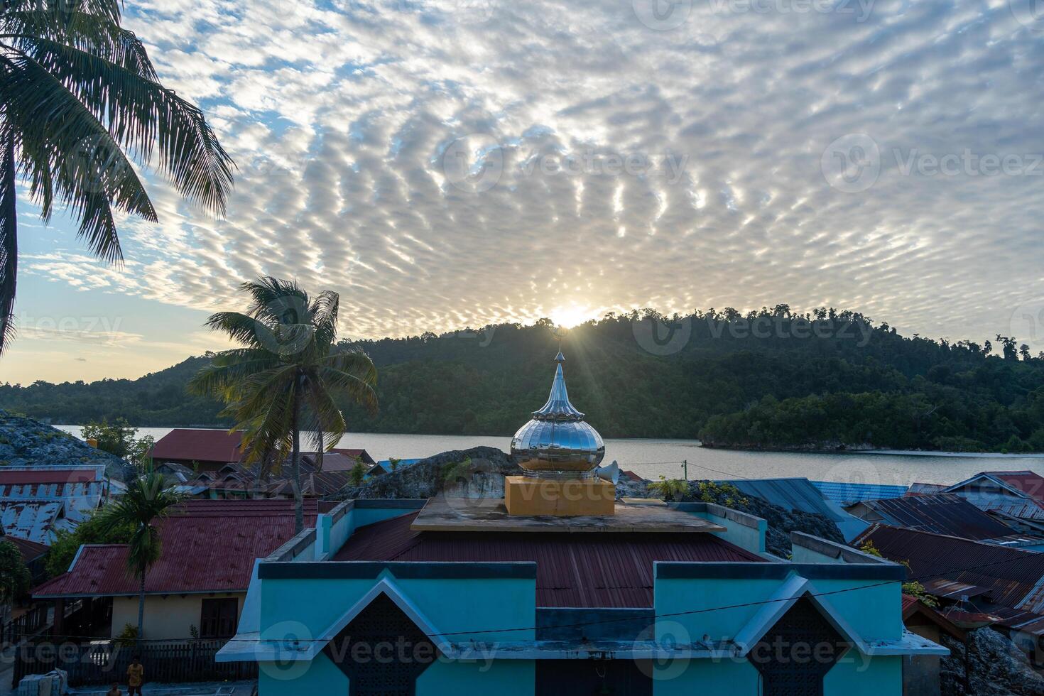 Sunset over Pulau Papan mosque and village, Malenge, Sulawesi, Indonesia photo