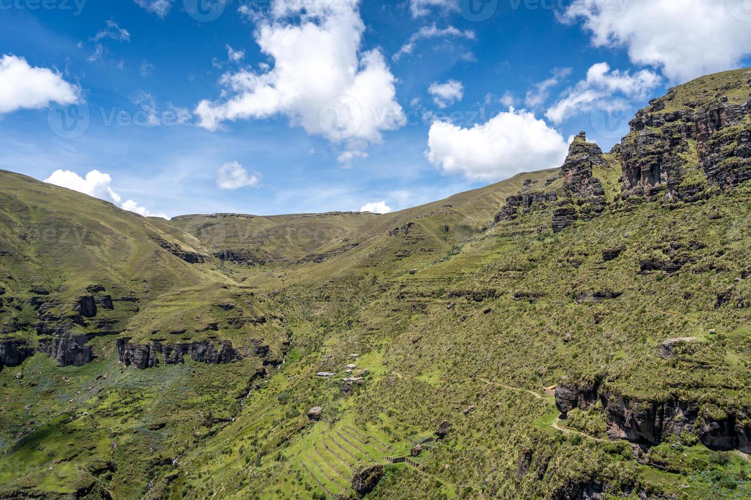 Rugged Rock Formations in the Andean Mountains at Waqrapukara, Peru photo